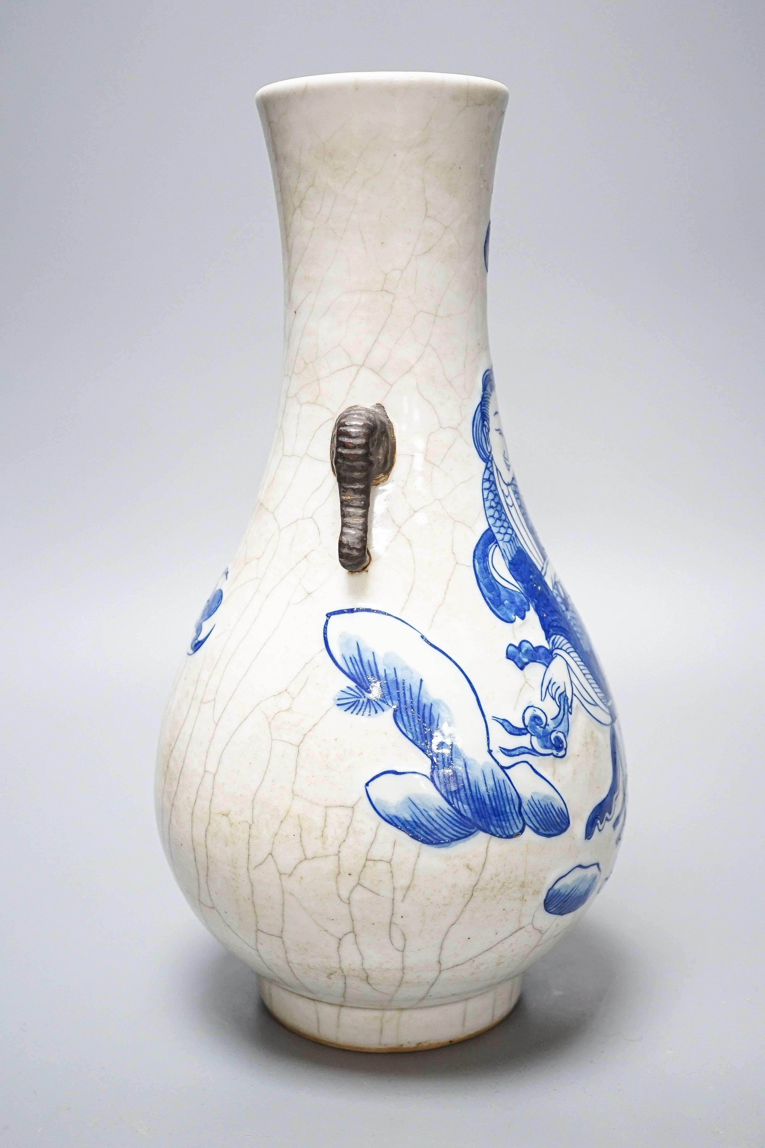 A Chinese crackle glaze porcelain two handled vase, painted in underglaze blue, seal mark, 27cm